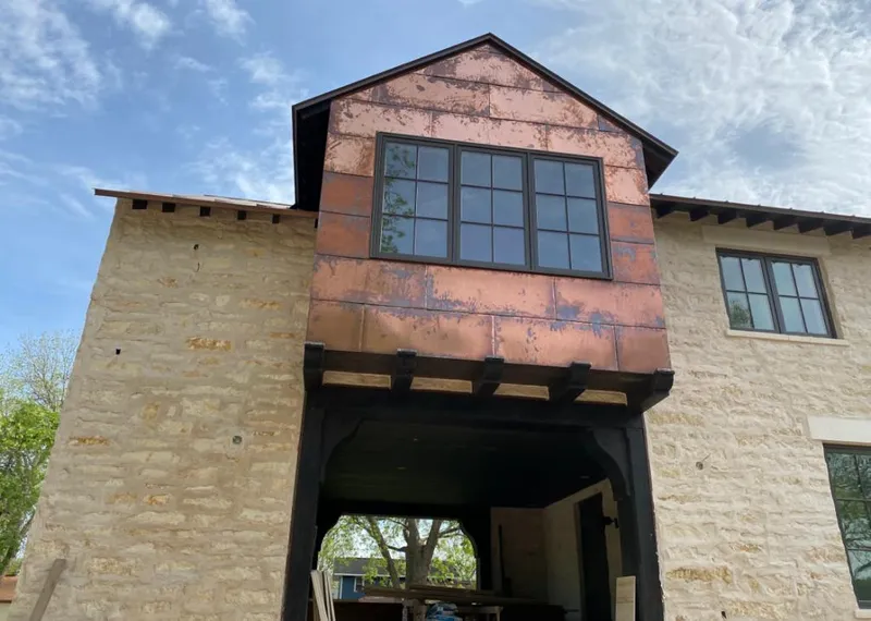 Copper metal panel facade on a stone building for Metal Roof Coating in Hickory